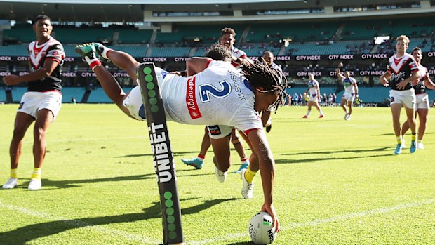 Dominic Young scores for Newcastle against the Roosters at the SCG.