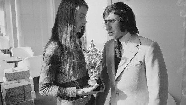 Jackie Stewart with Nina Rindt, who is holding Jochen's trophy for winning the 1970 world championship.