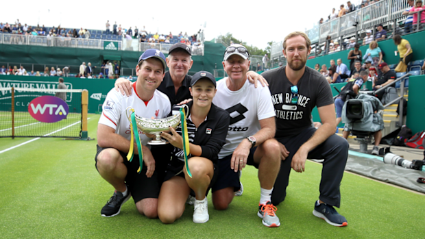 Ashleigh Barty and her team pose with the Birmingham Classic trophy.