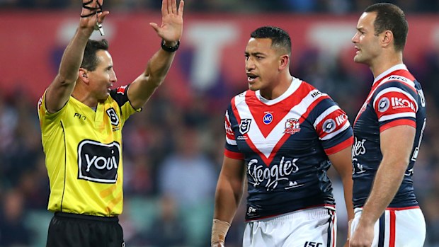 Siosiua Taukeiaho (C) of the Roosters is sent to the sin-bin by referee Gerard Sutton