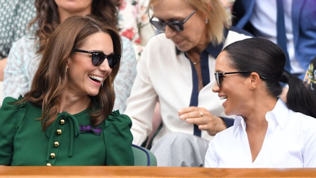  Catherine, Duchess of Cambridge and Meghan, Duchess of Sussex in the Royal Box on Centre Court during day twelve of the Wimbledon Tennis Championships at All England Lawn Tennis and Croquet Club on July 13, 2019 in London, England