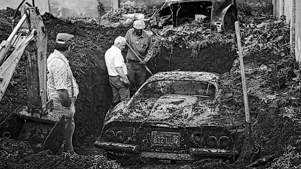 The Ferrari being excavated from a backyard in Los Angeles.