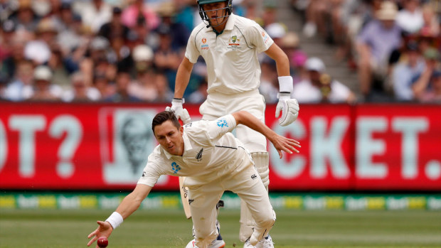 Boult dives for a ball off the MCG wicket