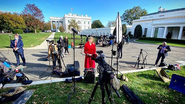 'It's on': Nine US Correspondent Adams checks her notes as she prepares for the camera to roll.