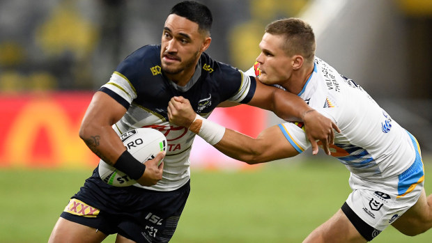 Valentine Holmes of the Cowboys is tackled during the round three NRL match between the North Queensland Cowboys and the Gold Coast Titans