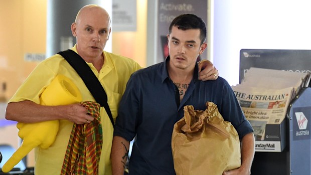 Anti-Islamic State fighter Ashley Dyball (right) walks with his father Scott as he arrives at Brisbane airport last December. (AAP)