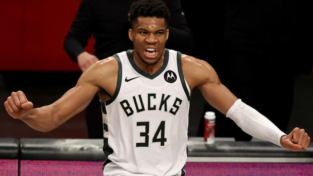 Giannis Antetokounmpo #34 of the Milwaukee Bucks celebrates the win of game seven of the Eastern Conference second round at Barclays Center on June 19, 2021 in the Brooklyn borough of New York City. 