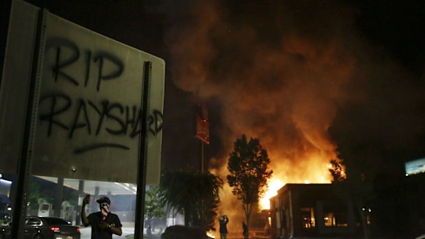 Protesters set fire to a Wendy's restaurant  in Atlanta where Rayshard Brooks was shot and killed by police following a struggle in the restaurant's drive-thru line. 