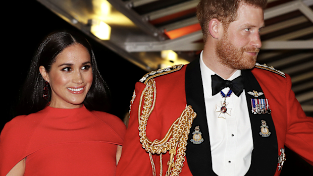In this Saturday March 7, 2020 file photo, Britain's Prince Harry and Meghan, Duchess of Sussex arrive at the Royal Albert Hall in London, to attend the Mountbatten Festival of Music. 