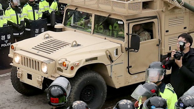 US military trailer carrying elements of the Terminal High Altitude Area Defense (THAAD) system enters a golf course in Seongju, about 300 kilometres southeast of Seoul. (AAP)