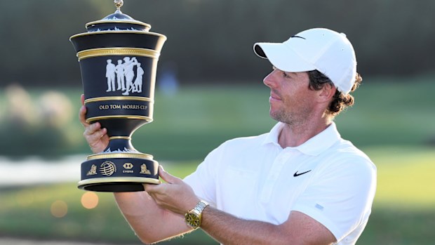 Rory McIlroy of Northern Ireland inspects the trophy after his victory in a playoff during Day Four of the WGC HSBC Champions at Sheshan International Golf Club
