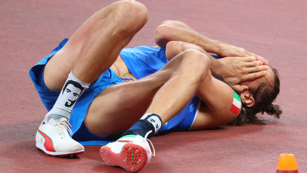 Gianmarco Tamberi of Team Italy celebrates after agreeing to share gold with Mutaz Essa Barshim of Team Qatar in the Men's High Jump Final at the Tokyo Olympics.