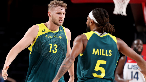 Jock Landale #13 of Team Australia and teammate Patty Mills #5 react against Team United States during the first half of a Men's Basketball quarterfinals game on day thirteen of the Tokyo 2020 Olympic Games at Saitama Super Arena on August 05, 2021 in Saitama, Japan. (Photo by Gregory Shamus/Getty Images)
