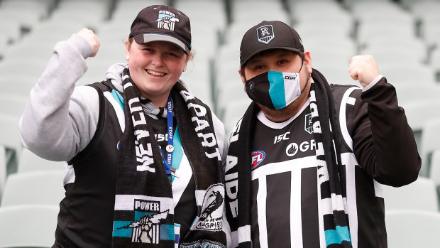 Port Adelaide fans in the prison bar jersey