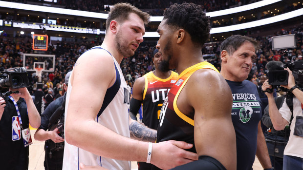  Luka Doncic and Donovan Mitchell embrace after the series win for Dallas