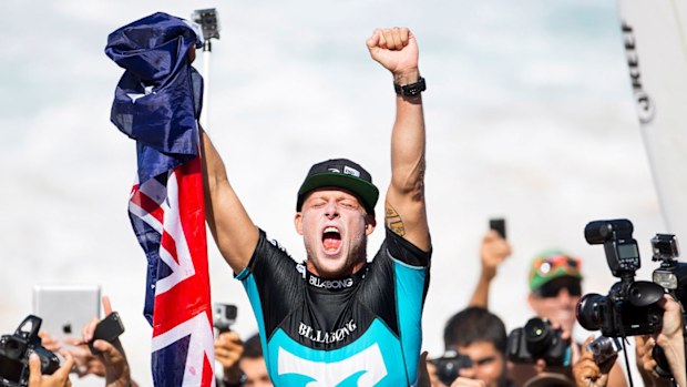 Mick Fanning celebrating winning his third world title in 2013.