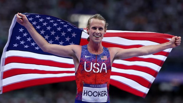 An elated Cole Hocker celebrates winning gold.