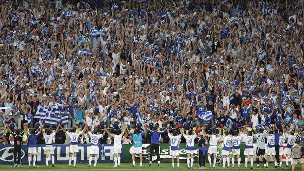 Greece celebrate with their fans after winning the Euro 2004 title.