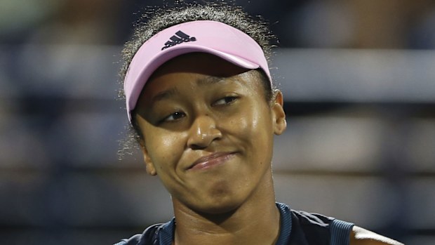 Naomi Osaka grimaces during her loss in Dubai.