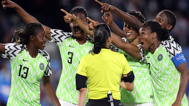 Nigeria players react to the penalty