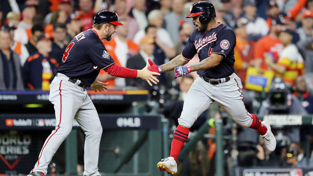  Howie Kendrick #47 of the Washington Nationals celebrates his two-run home run