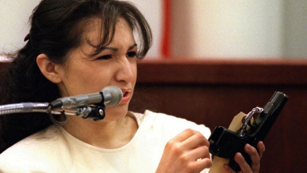 Diane Zamora holds the murder weapon while on the stand. (AAP)