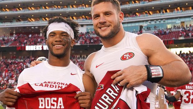  Kyler Murray #1 of the Arizona Cardinals and Nick Bosa #97 of the San Francisco 49ers exchange jersey after their NFL football game