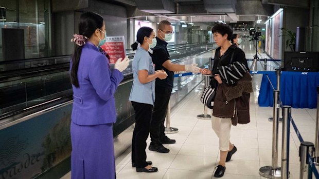 Travellers from Wuhan are screened upon arrival at Bangkok Airport, Thailand.