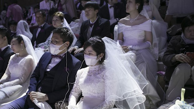 Some 4,000 'Moonies', believers of Unification Church, which was named after the founder Moon Sun Myung, attend the mass wedding which began in the early 1960s.