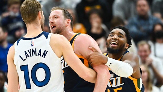  Donovan Mitchell #45 holds back Joe Ingles #2 of the Utah Jazz