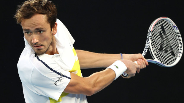  Daniil Medvedev of Russia plays a backhand in his Men's Singles Final match against Novak Djokovic of Serbia during day 14 of the 2021 Australian Open at Melbourne Park 