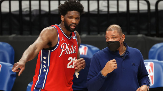 Superstar 76 Joel Embiid and coach Doc Rivers
