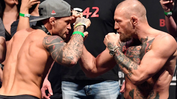 Conor McGregor and Dustin Poirier face-off ahead of UFC 257. (Getty)