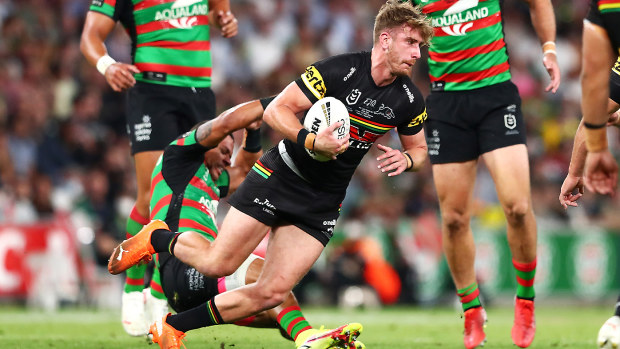 Dane Gagai of the Rabbitohs falls away after an attempted tackle on Paul Momirovski 