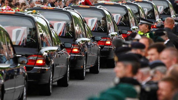 The coffins of seven British soldiers killed in Afghanistan, are driven through the town of Wootton Bassett in 2010.