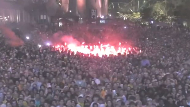 Fed Square in Melbourne erupts with joy after the Socceroos won against Tunisia in the World Cup.