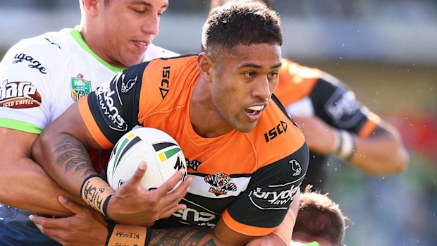 Michael Chee Kam of the Tigers looks for support during the round 22 NRL match between the Canberra Raiders and the Wests Tigers.
