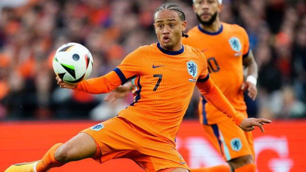 Netherlands attacking midfielder Xavi Simons shoots at goal during a friendly match against Iceland at De Kuip on June 10, 2024 in Rotterdam, Netherlands.