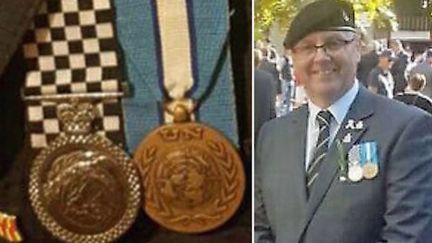 Barry Urban with chequered medal he bought online. (Facebook/Barry Urban MLA)