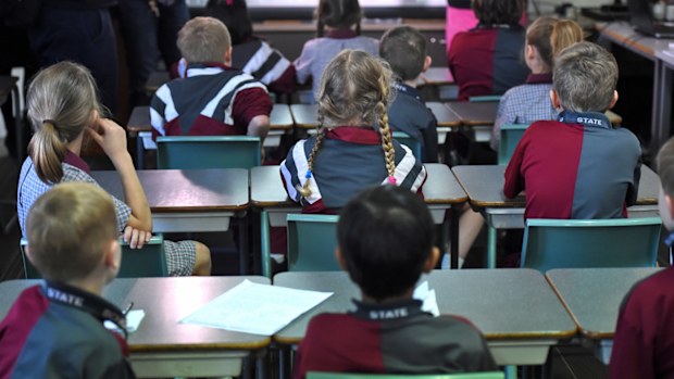 Children sit in a classroom during a lesson at Stafford State School in Brisbane, Wednesday, Aug. 5, 2015. 