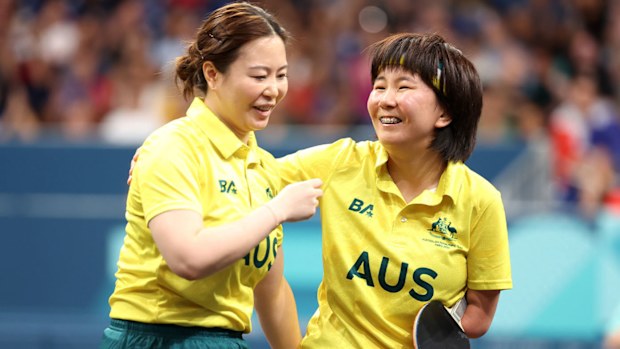 Li Na Lei and Qian Yang celebrate winning gold in table tennis.