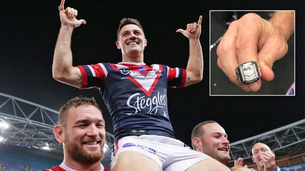 Cooper Cronk is carried off the field by teammates and inset, Mitch Aubusson models the 2019 NRL Premiership ring.