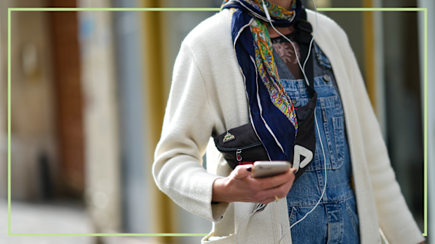 9PR: Woman walking wearing Apple corded EarPods
