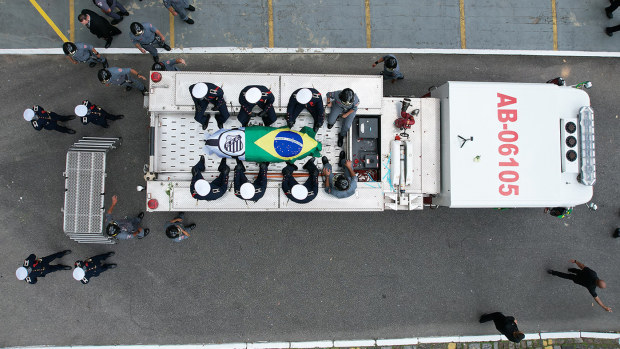 Aerial view of the coffin of Brazilian football legend Pelé arriving at the Santos Memorial Cemetery.