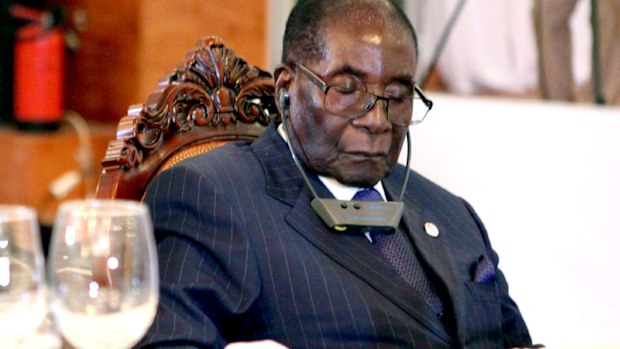 A photograph from January 13 shows Zimbabwe President Robert Mugabe with his eyes closed while attending a state dinner. (AFP)