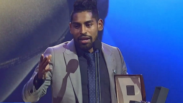 Krishna accepts his award