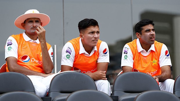 Mohammad Abbas (L) of Pakistan looks on after being left out of Pakistan's XI 