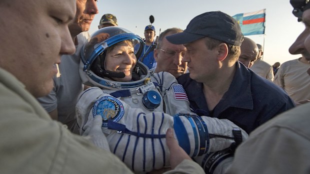 Expedition 52 NASA astronaut Peggy Whitson is helped out of the Soyuz MS-04 spacecraft. (Photo: AP)