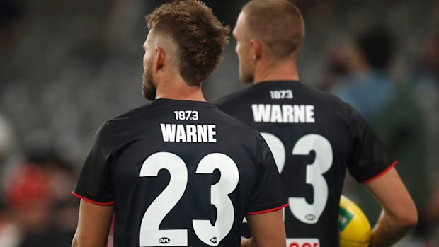 Saints players are seen wearing a warm-up top in memory of Shane Warne