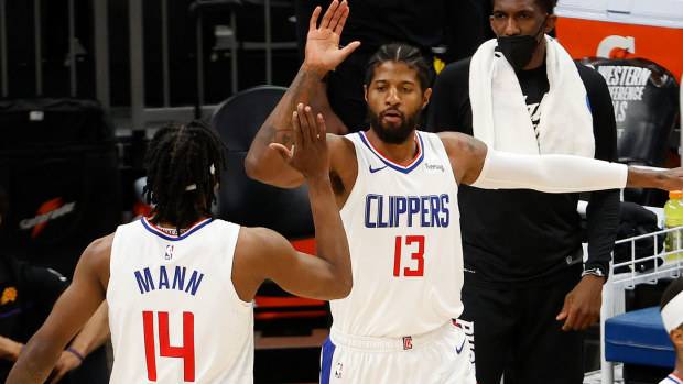  Paul George #13 of the LA Clippers celebrates with Terance Mann #14 during the first half in Game Five of the Western Conference Finals